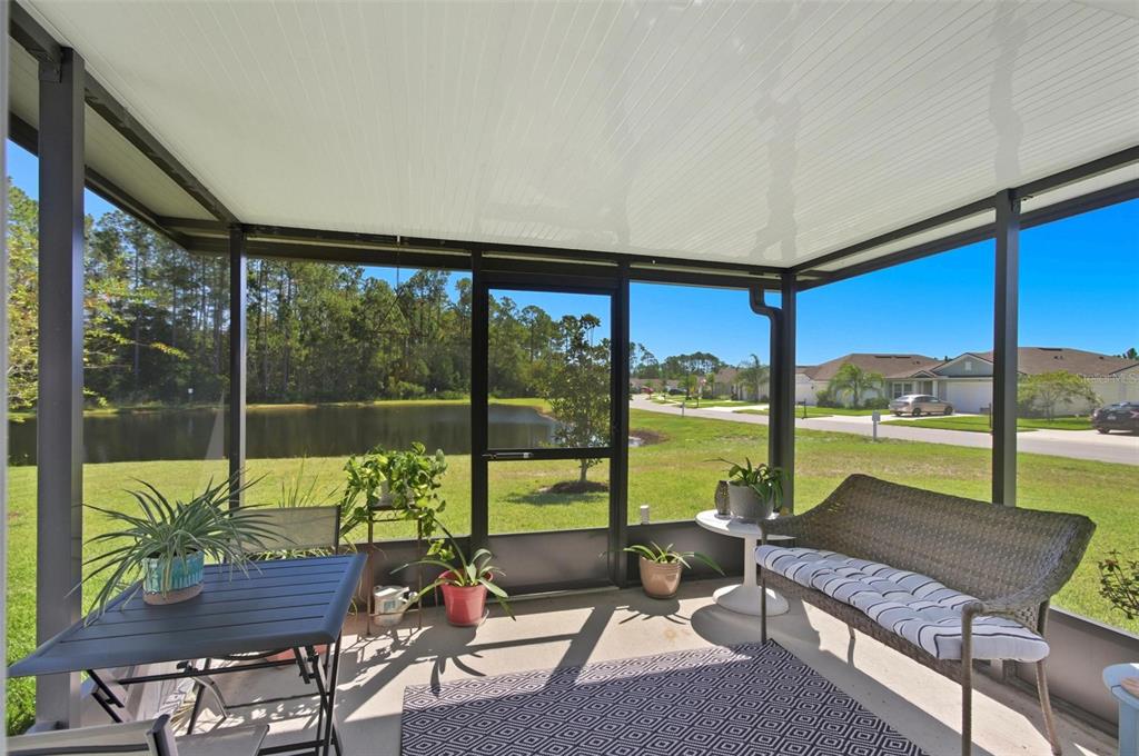 2 Pinnacle Place Bunnell, FL 32110 - Photo 51 of 83 a living room with a floor to ceiling window and pool table