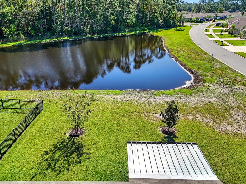 2 Pinnacle Place Bunnell, FL 32110 - Photo 54 of 83 a view of a lake with a yard and outdoor seating