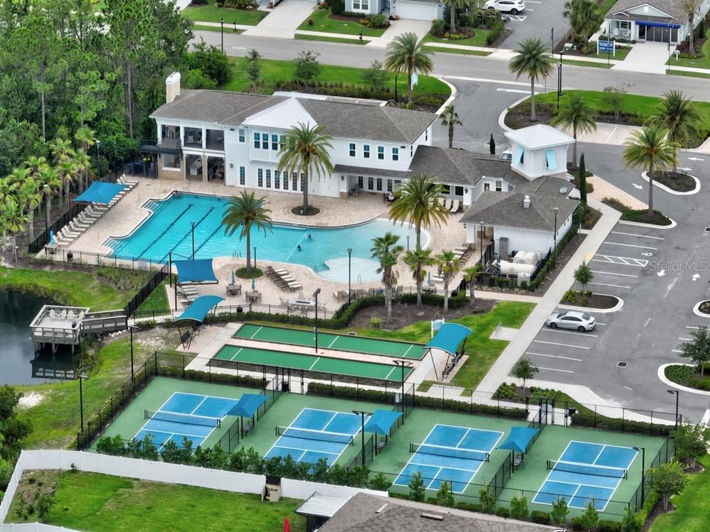 2 Pinnacle Place Bunnell, FL 32110 - Photo 71 of 83 an aerial view of a house with a garden potted plants and large trees
