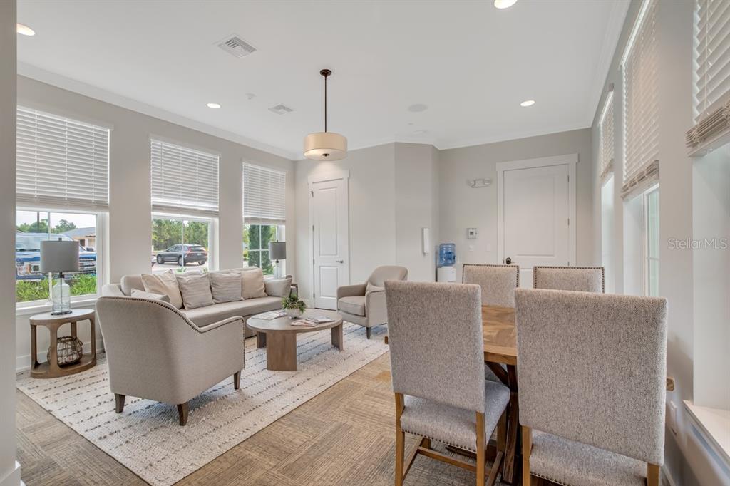 2 Pinnacle Place Bunnell, FL 32110 - Photo 73 of 83 a living room with furniture and a chandelier