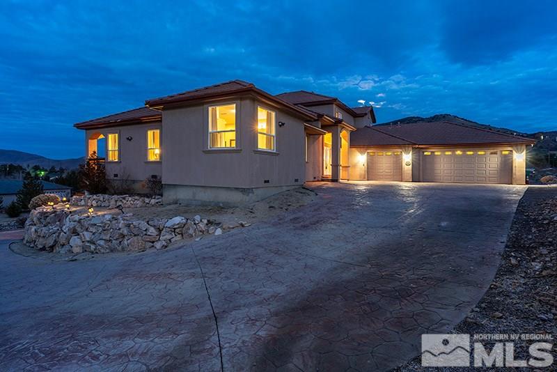 13520 Rim Rock Drive Reno, NV 89521 - Photo 1 of 25 a front view of a house with a yard