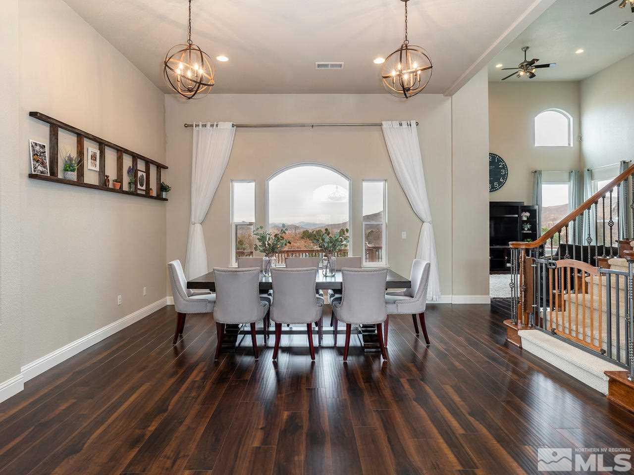 13520 Rim Rock Drive Reno, NV 89521 - Photo 12 of 25 a view of a dining room with furniture window and wooden floor