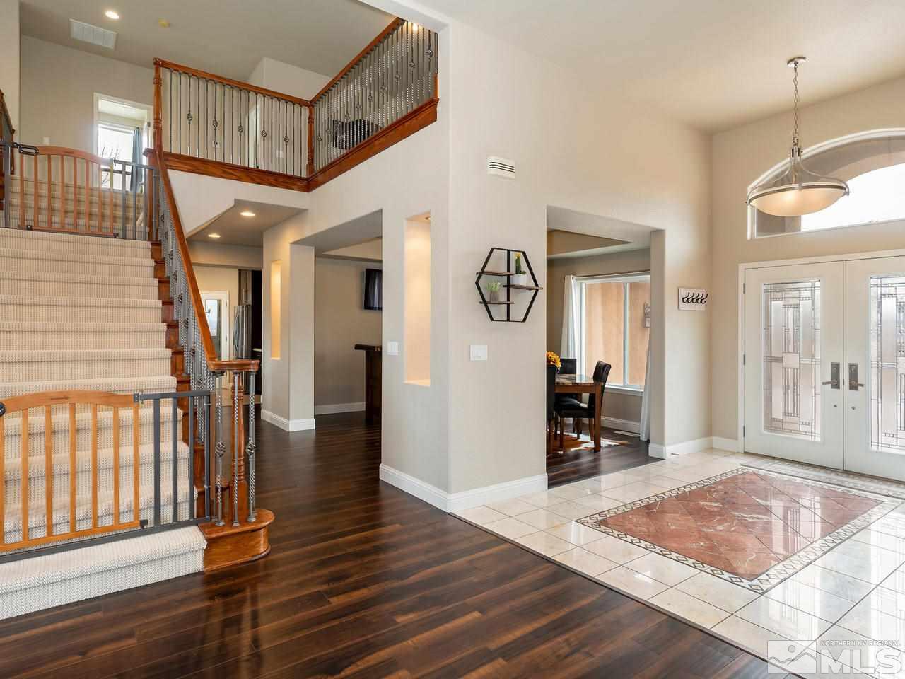 13520 Rim Rock Drive Reno, NV 89521 - Photo 13 of 25 a view of a hallway with wooden floor and windows