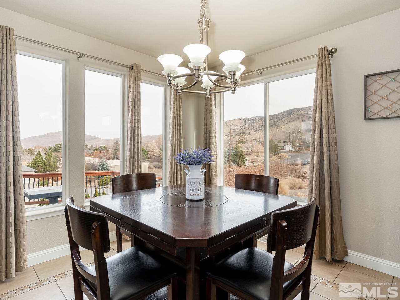 13520 Rim Rock Drive Reno, NV 89521 - Photo 20 of 25 a view of a dining room with furniture window and outside view