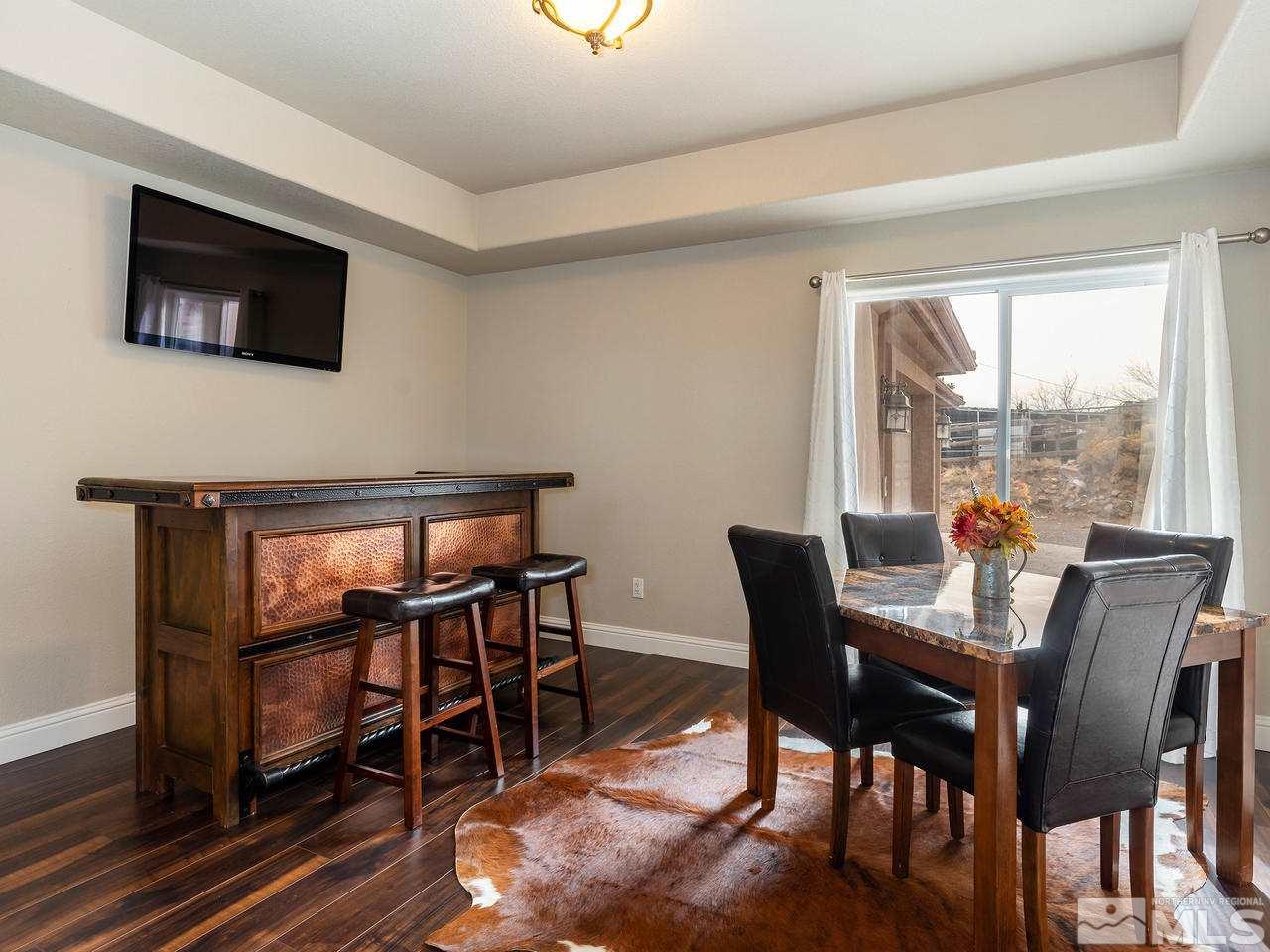 13520 Rim Rock Drive Reno, NV 89521 - Photo 21 of 25 a view of a dining room with furniture window and wooden floor