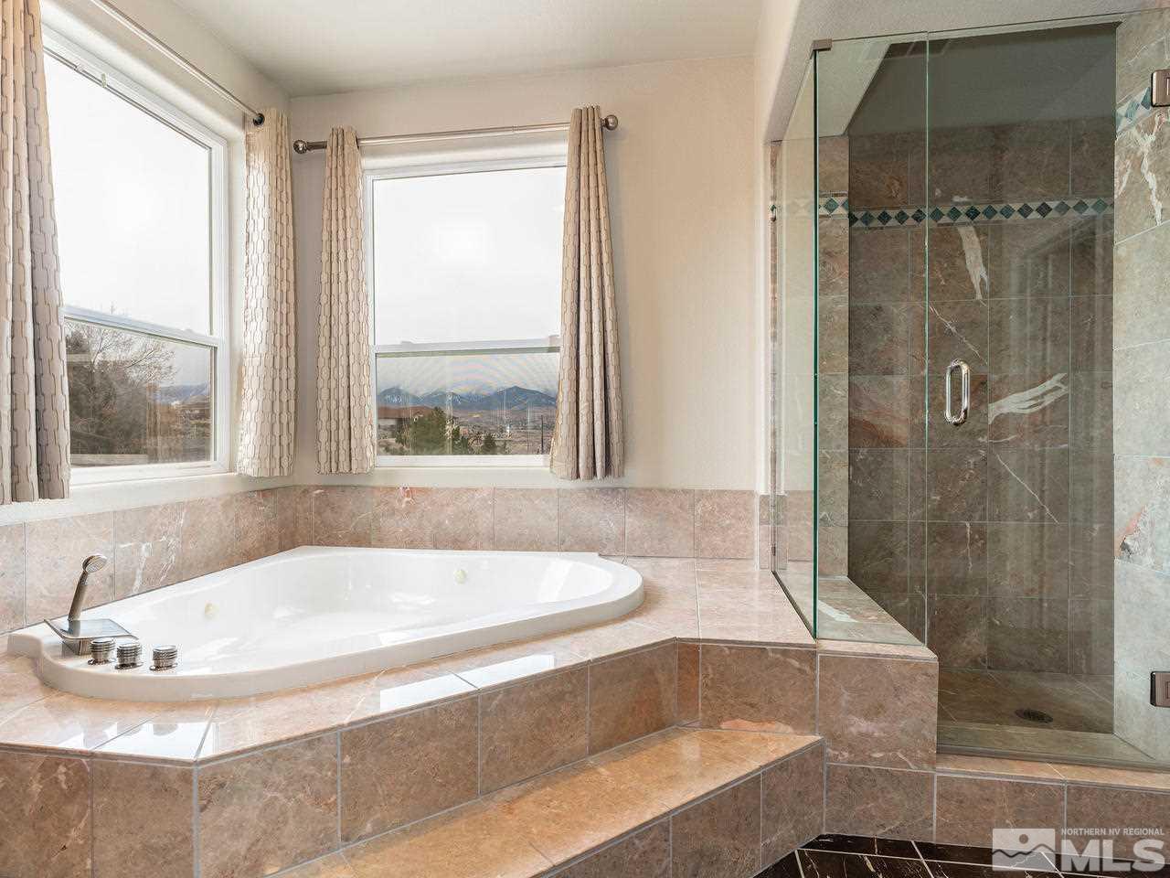 13520 Rim Rock Drive Reno, NV 89521 - Photo 24 of 25 a bath tub sitting next to a window