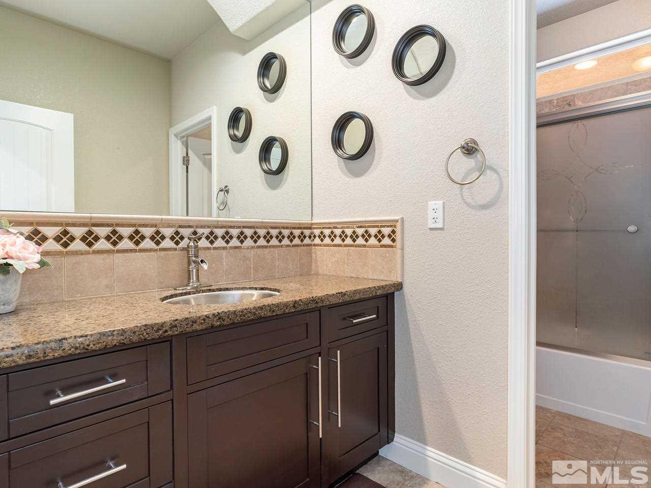 13520 Rim Rock Drive Reno, NV 89521 - Photo 25 of 25 a sink and a granite top with a sink
