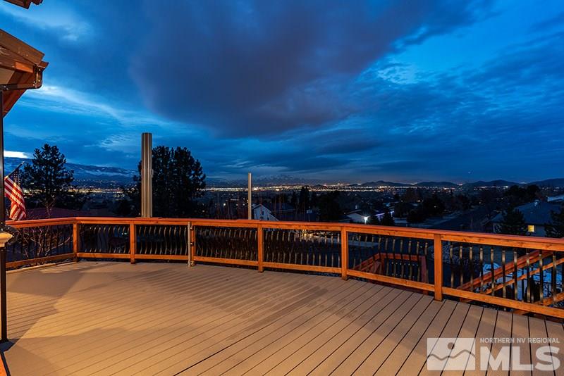 13520 Rim Rock Drive Reno, NV 89521 - Photo 8 of 25 a view of a balcony with wooden floor and city view
