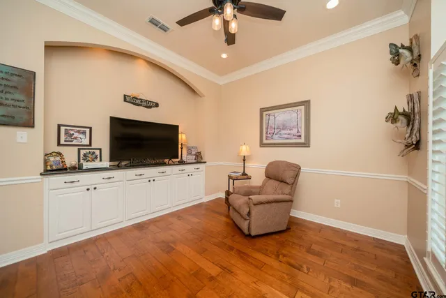 a en suite bathroom with a toilet sink and a large mirror