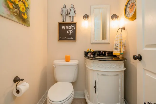 a kitchen with a refrigerator and a sink