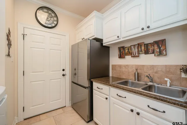 a view of bathroom with washer and dryer