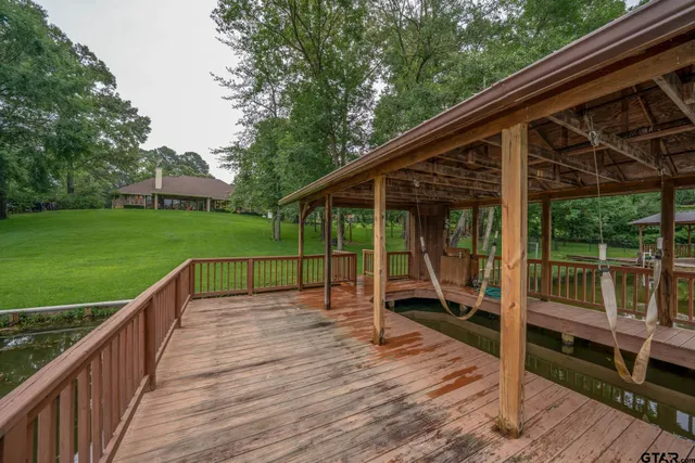 an aerial view of lake residential house and ocean view