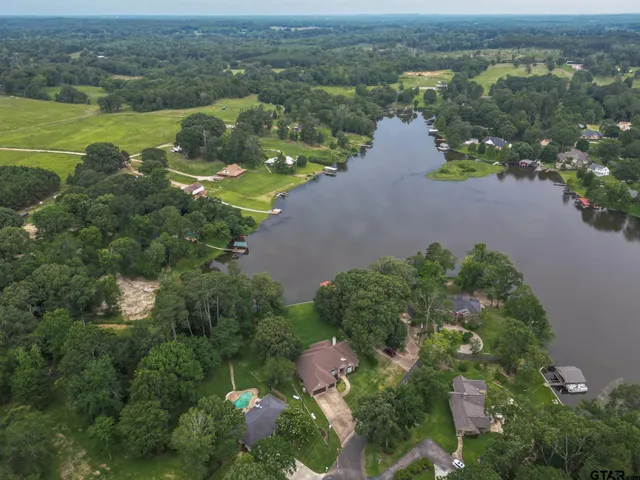an aerial view of house with yard