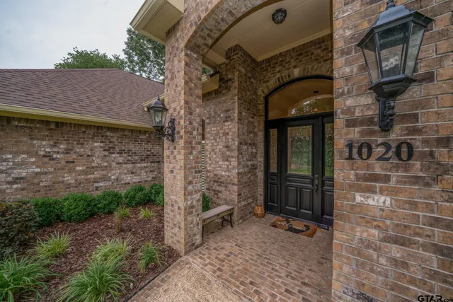a dining room with furniture and a chandelier