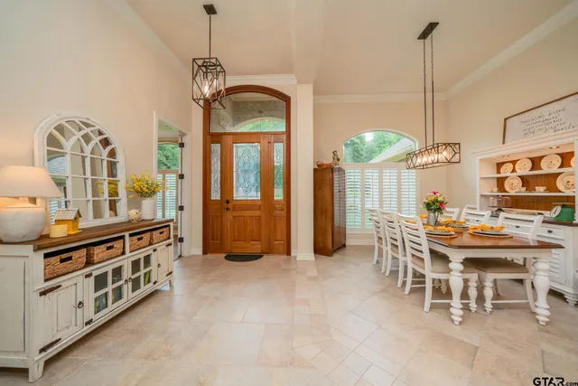 a view of a dining room with furniture window and chandelier