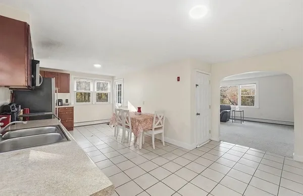 a view of a livingroom with furniture and windows