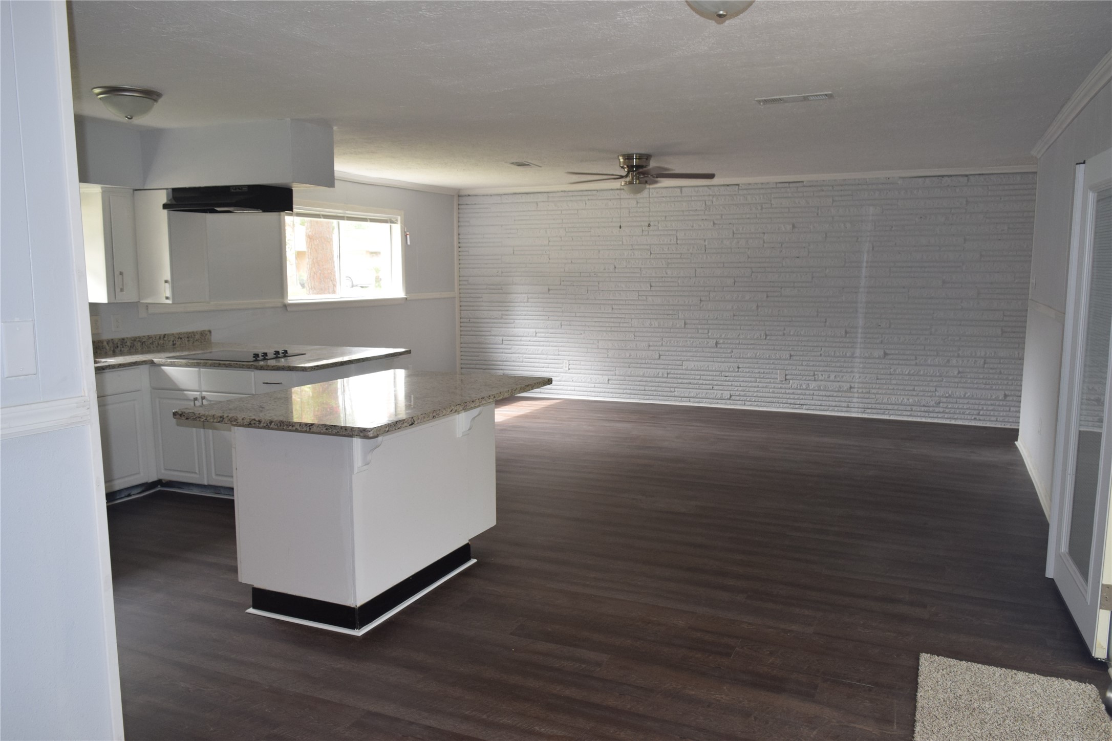 9902 Tolman Street Houston, TX 77034 - Photo 13 of 26 a room with a sink cabinets and wooden floor
