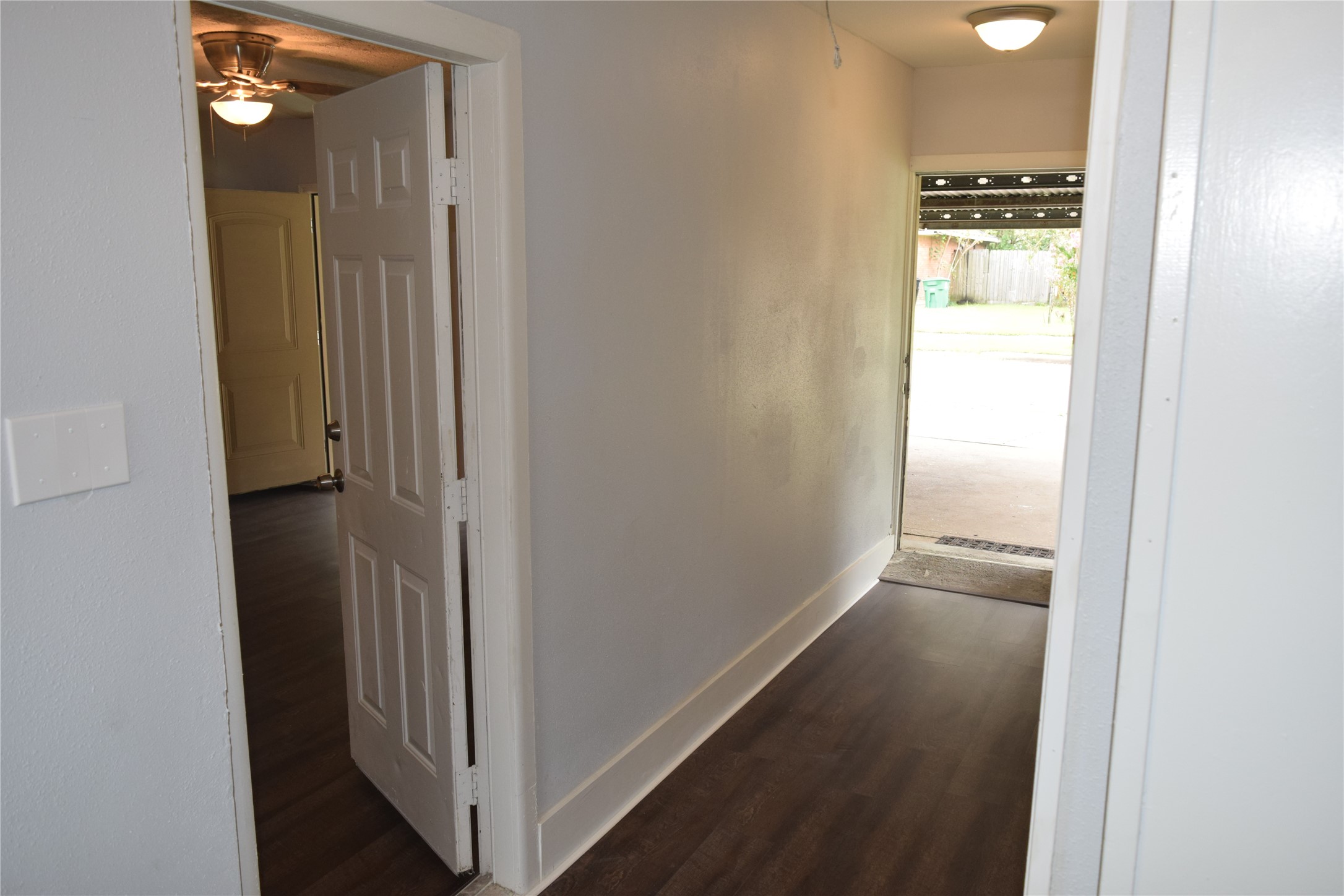 9902 Tolman Street Houston, TX 77034 - Photo 17 of 26 a view of a hallway with wooden floor