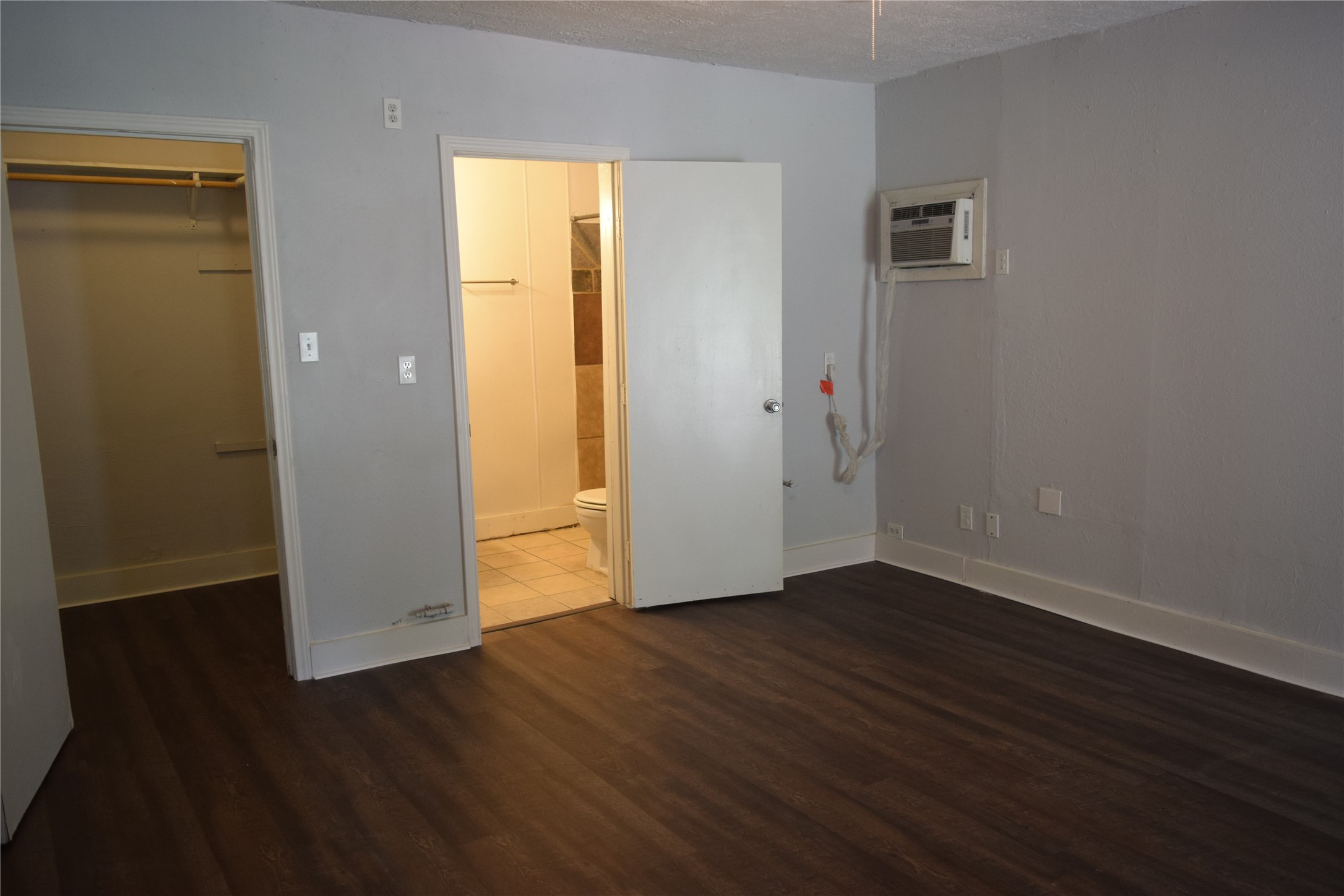 9902 Tolman Street Houston, TX 77034 - Photo 19 of 26 an empty room with wooden floor and closet