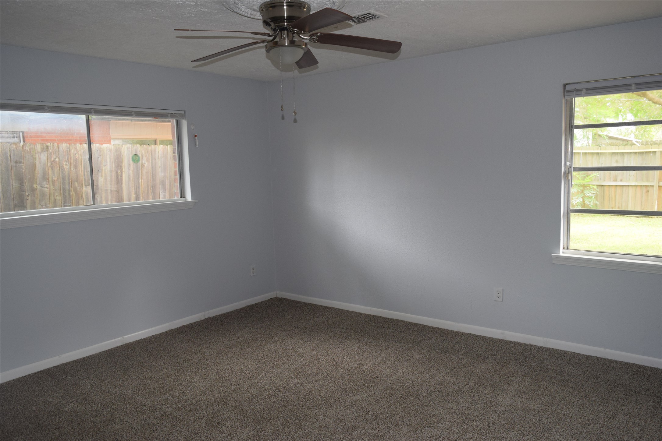 9902 Tolman Street Houston, TX 77034 - Photo 4 of 26 an empty room with a window