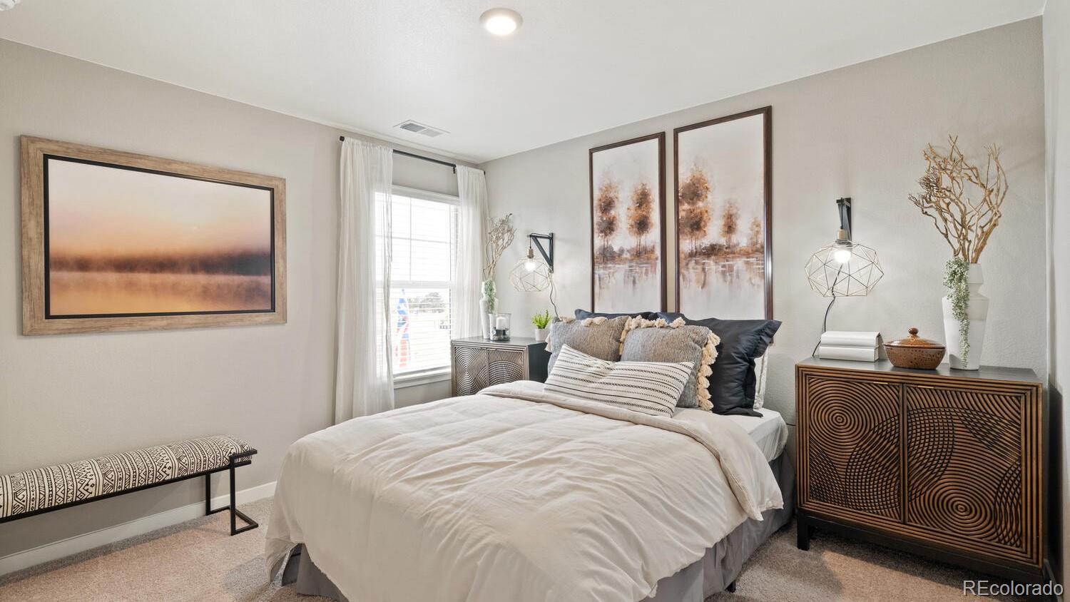 1531 Pinnacle Avenue Lochbuie, CO 80603 - Photo 20 of 25 a bedroom with a large bed and a desk