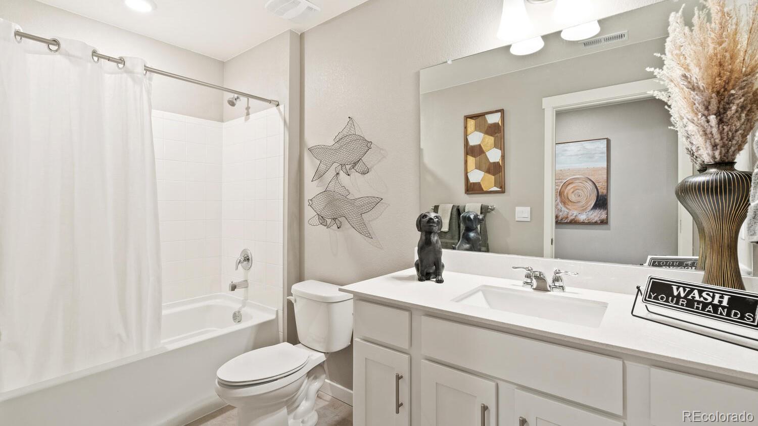 1531 Pinnacle Avenue Lochbuie, CO 80603 - Photo 21 of 25 a bathroom with a sink toilet and shower