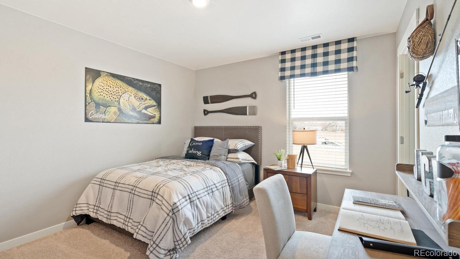 1531 Pinnacle Avenue Lochbuie, CO 80603 - Photo 22 of 25 a bedroom with a bed and a painting on the wall