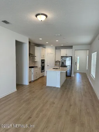 a view of kitchen with wooden floor