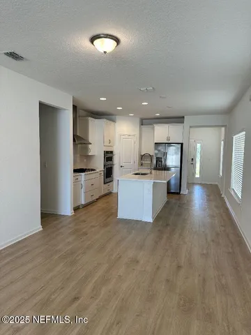 a view of kitchen with wooden floor
