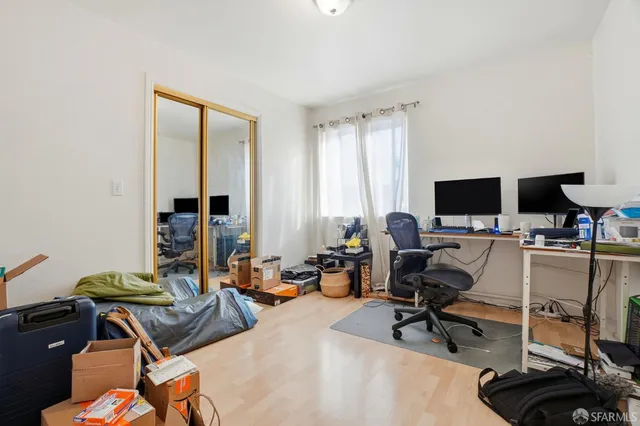 a view of a workspace with a window and lounge chair