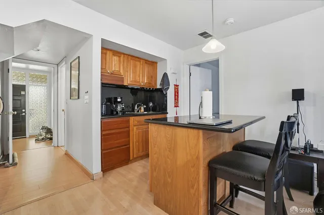 a kitchen with a table and chairs