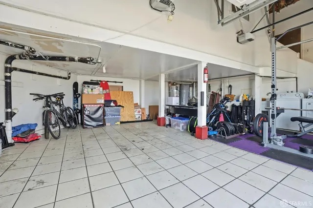 a view of a garage with rack and bicycle