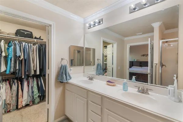 a bathroom with a double vanity sink and a mirror