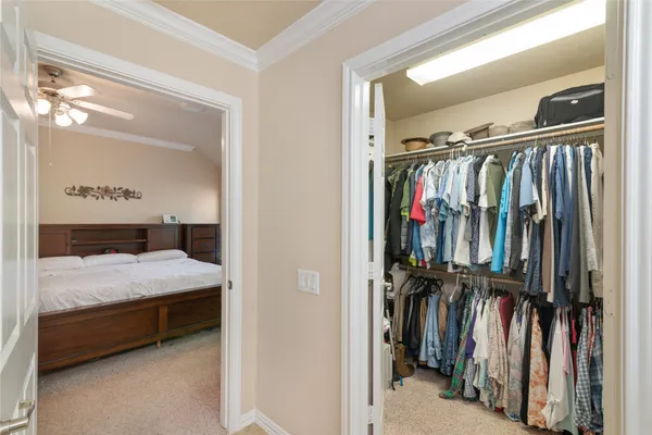 a bed room with a bed and a walk in closet