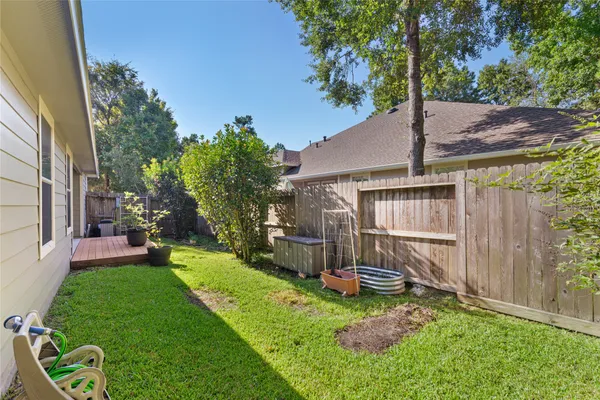 a view of a backyard with a small cabin and a chair