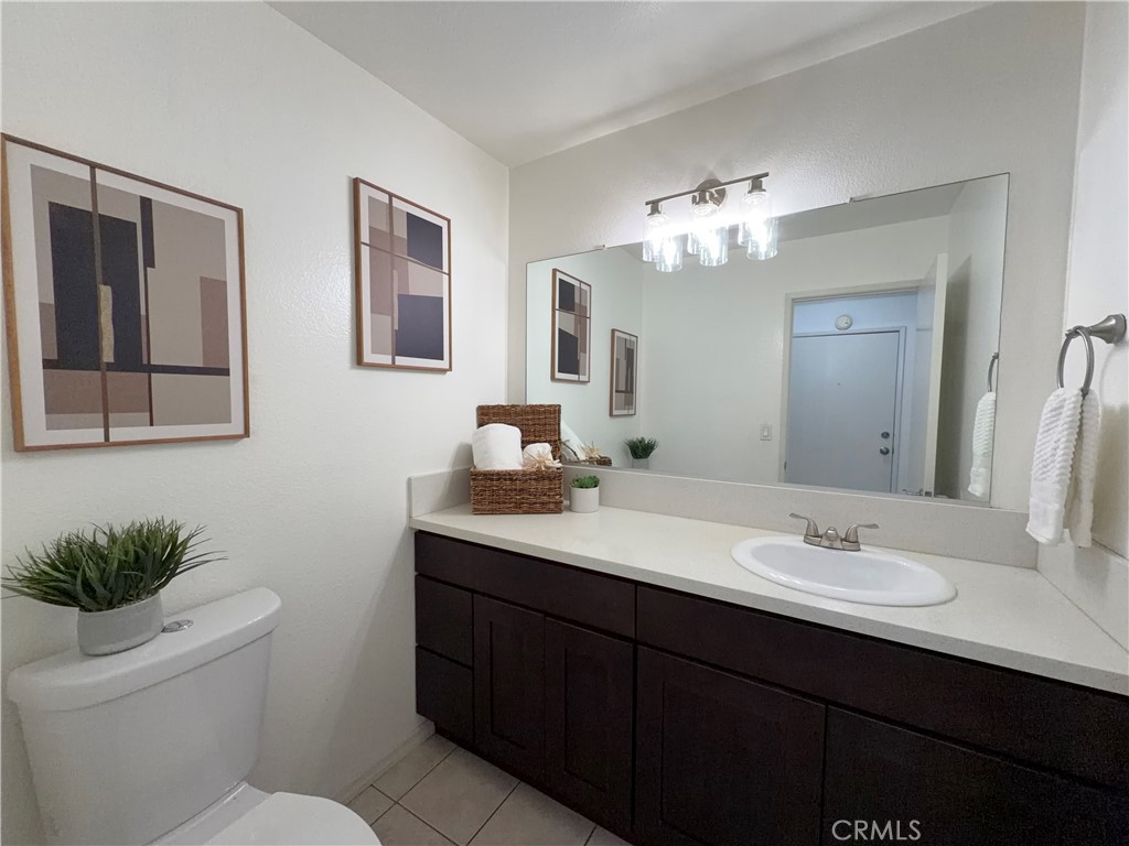 1044 Kent San Dimas, CA 91773 - Photo 6 of 16 a bathroom with a toilet a sink and mirror