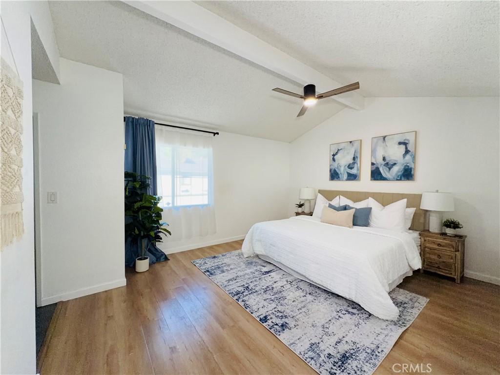 1044 Kent San Dimas, CA 91773 - Photo 10 of 16 a bedroom with a large bed and a potted plant