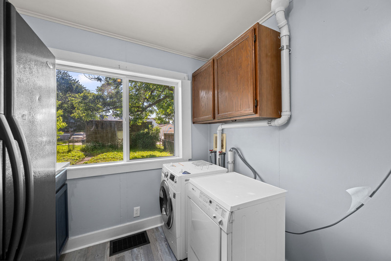 1419 17th Street Moline, IL 61265 - Photo 24 of 28 a view of a kitchen with a sink and dishwasher with wooden floor