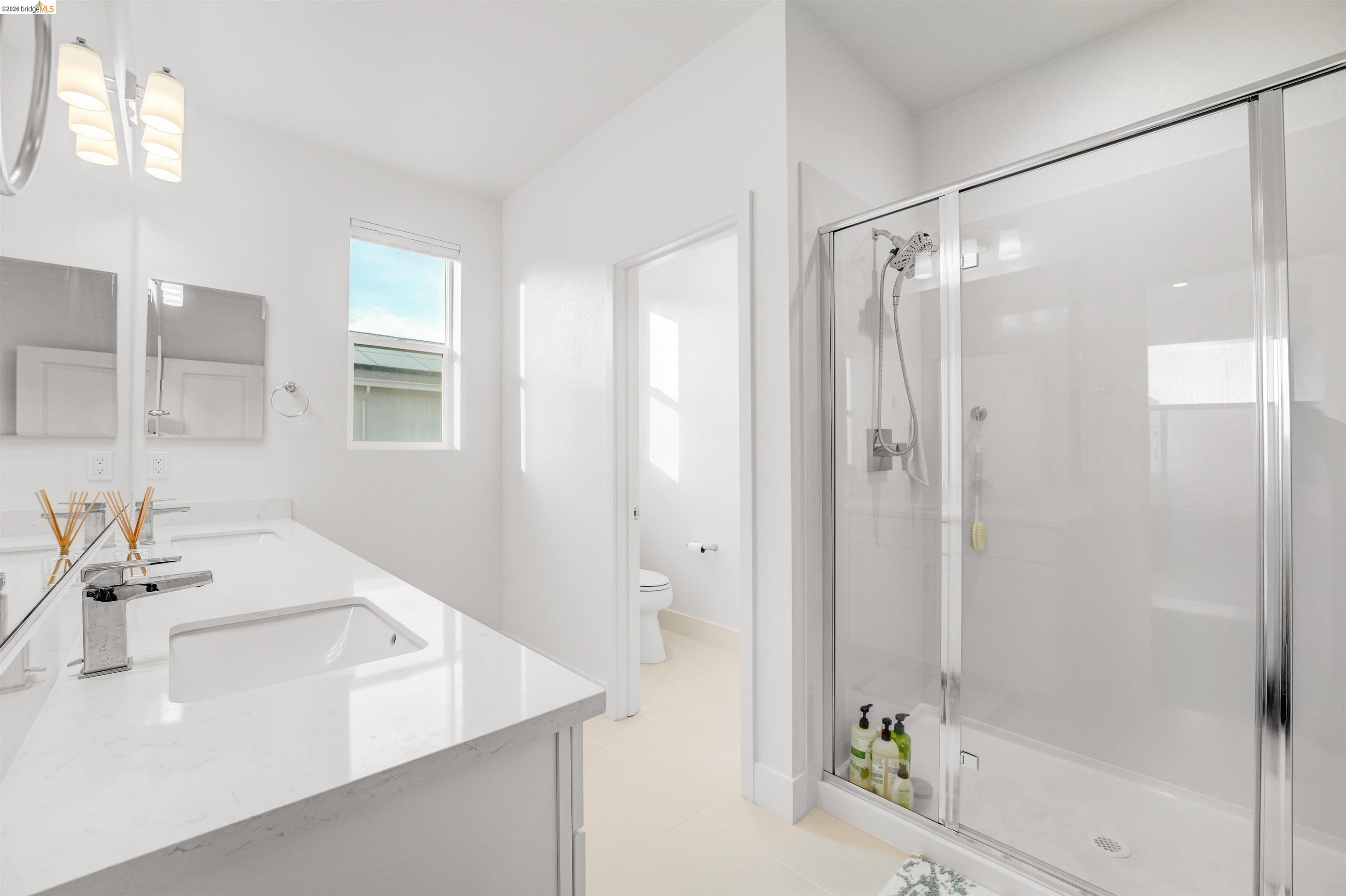 7101 Melon Court San Ramon, CA 94583 - Photo 46 of 58 a bathroom with a sink tub shower and a mirror
