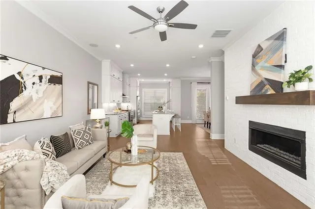 a living room with furniture and a fireplace