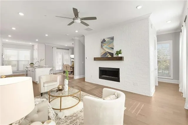a living room with furniture and a fireplace