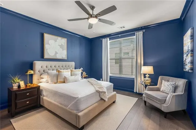 a bedroom with a bed and a couch