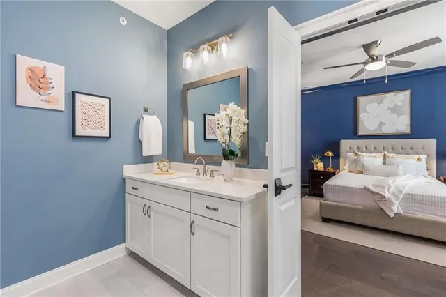a spacious bathroom with a double vanity sink and a mirror