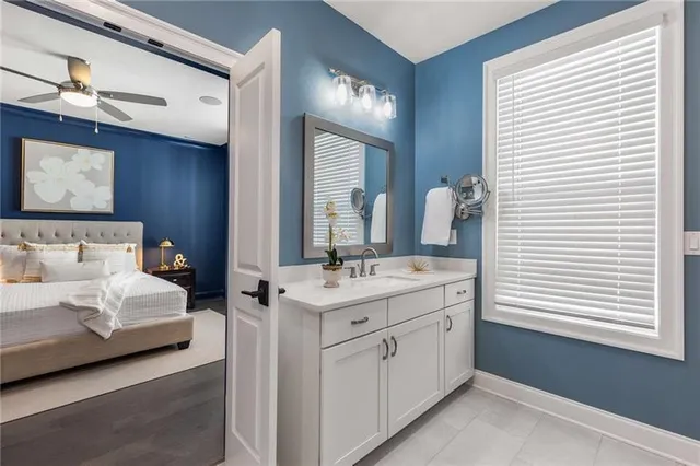 a spacious bathroom with a double vanity sink and a mirror