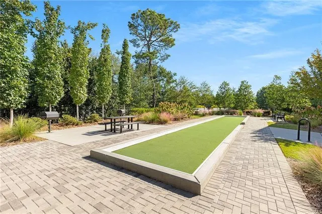 a view of a swimming pool with lounge chair