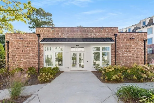 front view of a house with a bench