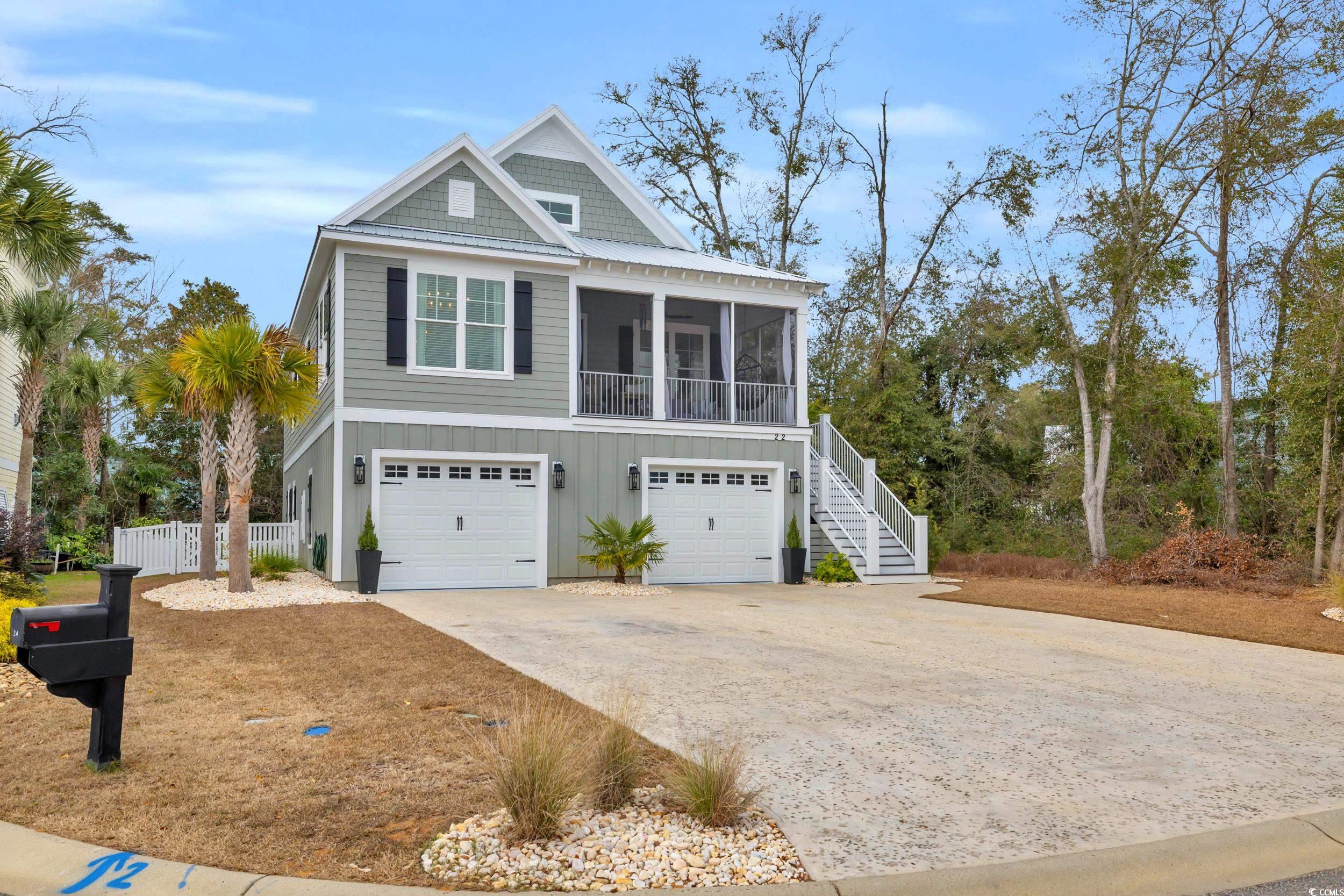 22 Trigger Fish Lane Murrells Inlet, SC 29576 - Photo 2 of 39 View of front of house with a sunroom and a garage
