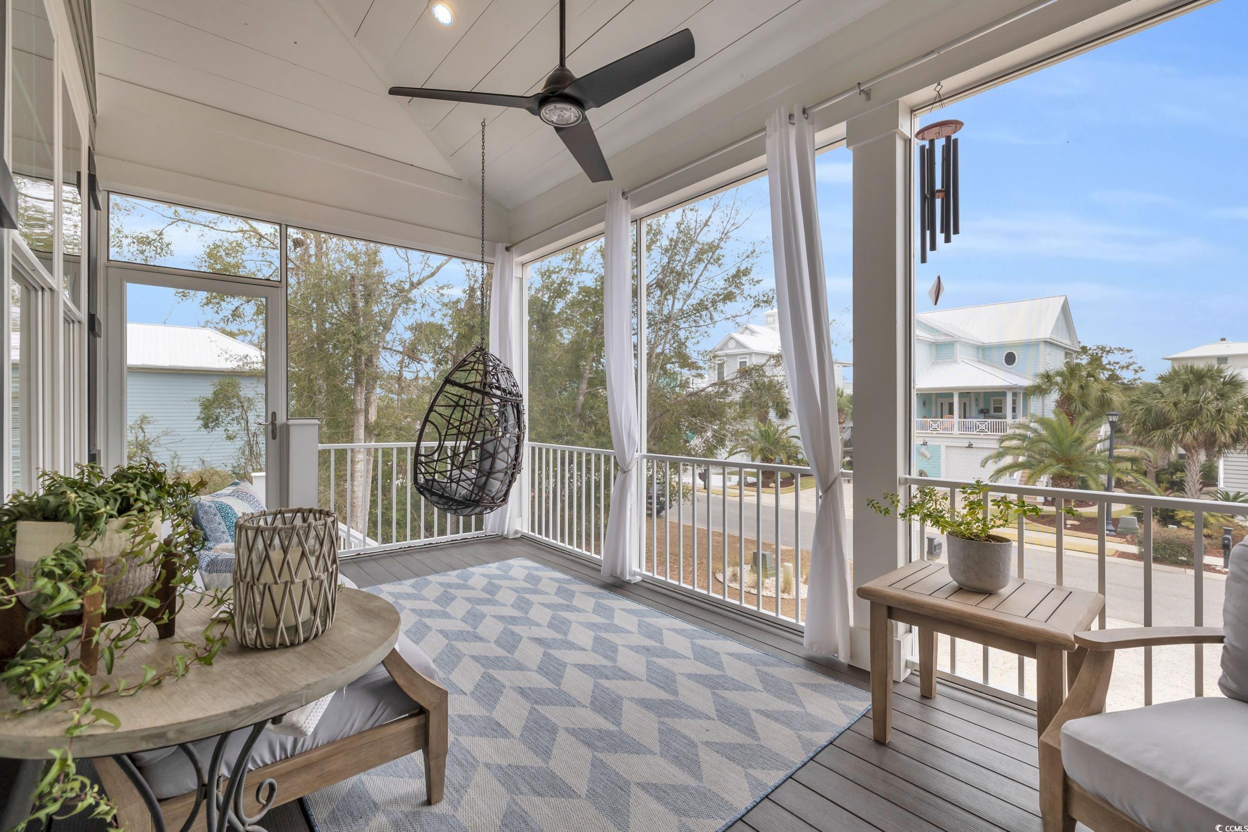 22 Trigger Fish Lane Murrells Inlet, SC 29576 - Photo 3 of 39 Sunroom featuring ceiling fan and vaulted ceiling