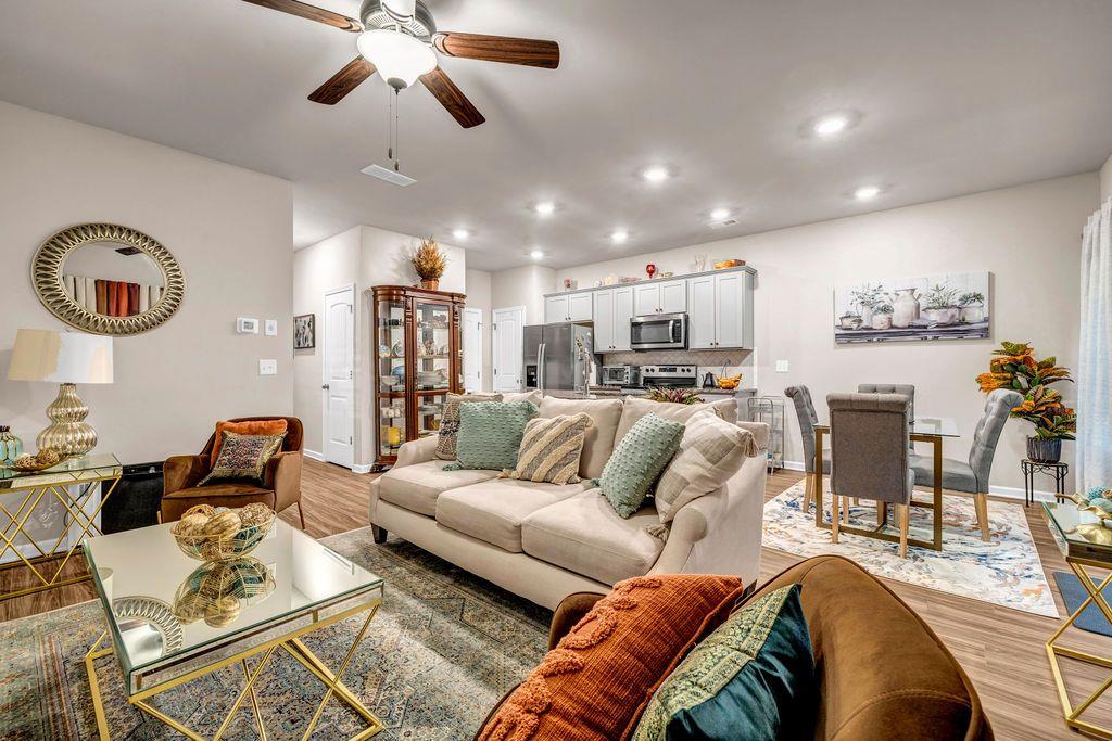 255 Skipjack Court Covington, GA 30016 - Photo 13 of 24 a living room with furniture and kitchen view