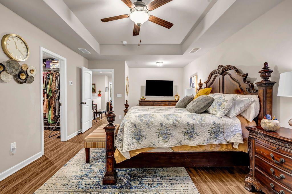 255 Skipjack Court Covington, GA 30016 - Photo 16 of 24 a bedroom with a bed and a chandelier